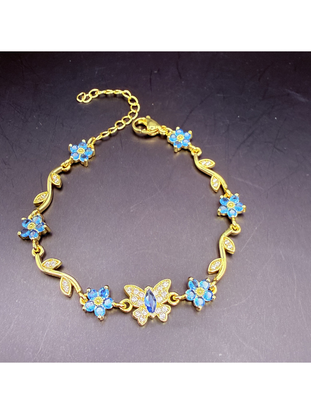 candy+clover Blue Crystal Flowers & Butterfly Gold Tone Bracelet
